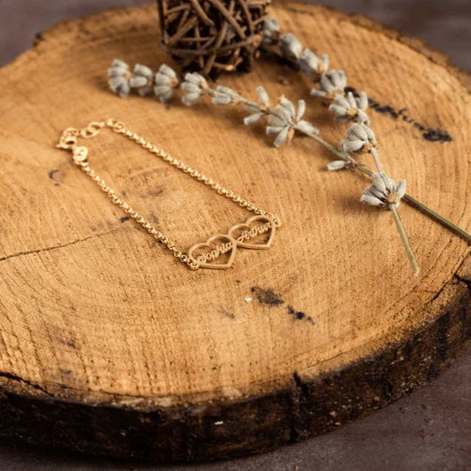 Product image of the Eraya Jewel Custom 'His and Hers' Heart Name Bracelet set in a luxurious Gold finish, perfect as a personalized couple's gift.