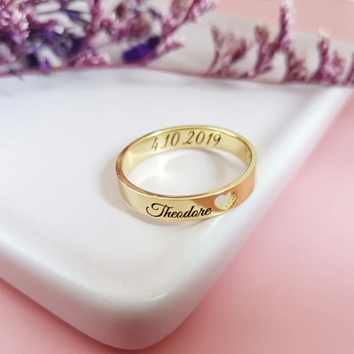 Cufflinks with the name Theodore: Silver or metal cufflinks with the name "Theodore" prominently displayed, possibly in a classic or modern font.