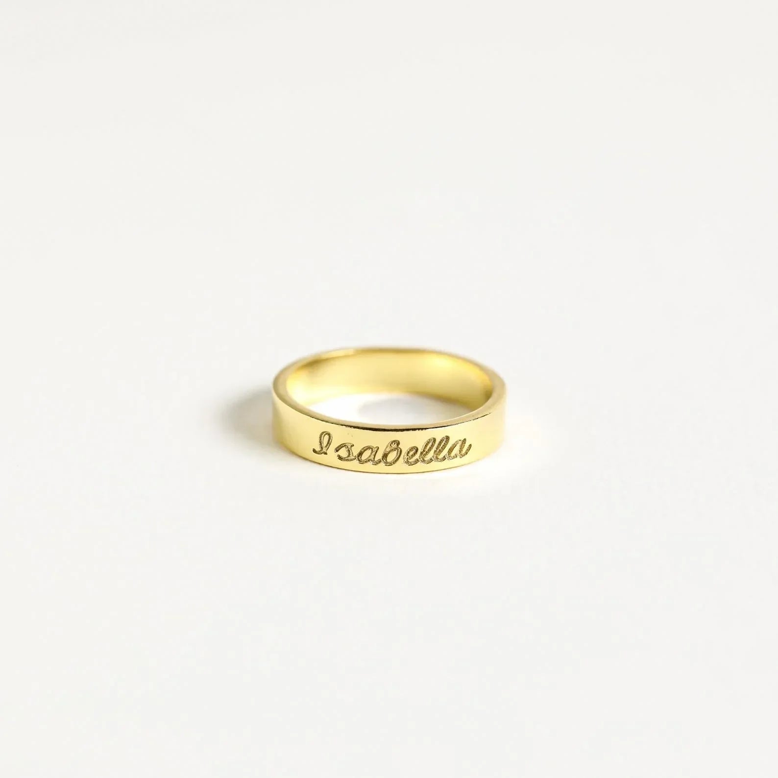 Close-up showing detail of silver Personalized Name Engraved Ring by Eraya Jewel worn on finger.