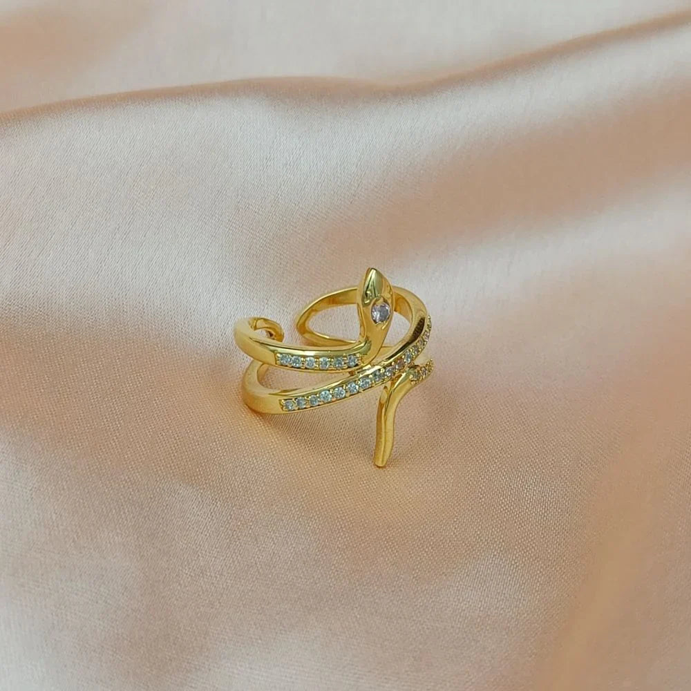 Polished gold Snake Ring with Diamond accent, showcasing elegant serpent design.