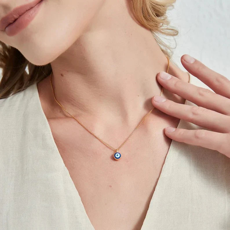 Close-up of the Evil Eye Protector Pendant featuring a detailed blue Turkish evil eye charm on a polished finish