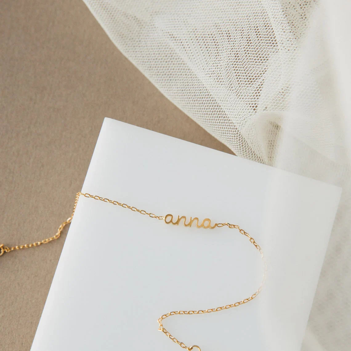 Product image of the Eraya Jewel Dainty Layering Name Bracelet in polished Silver, featuring its delicate chain and custom name option.