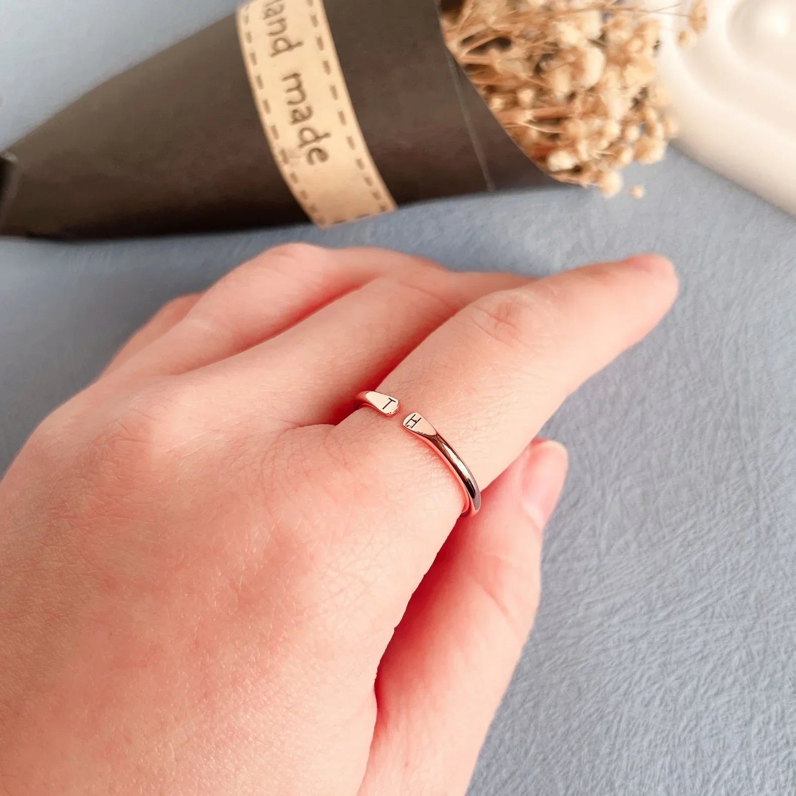 Model wearing the Custom Open Two Initial Ring in a modern rose gold finish.