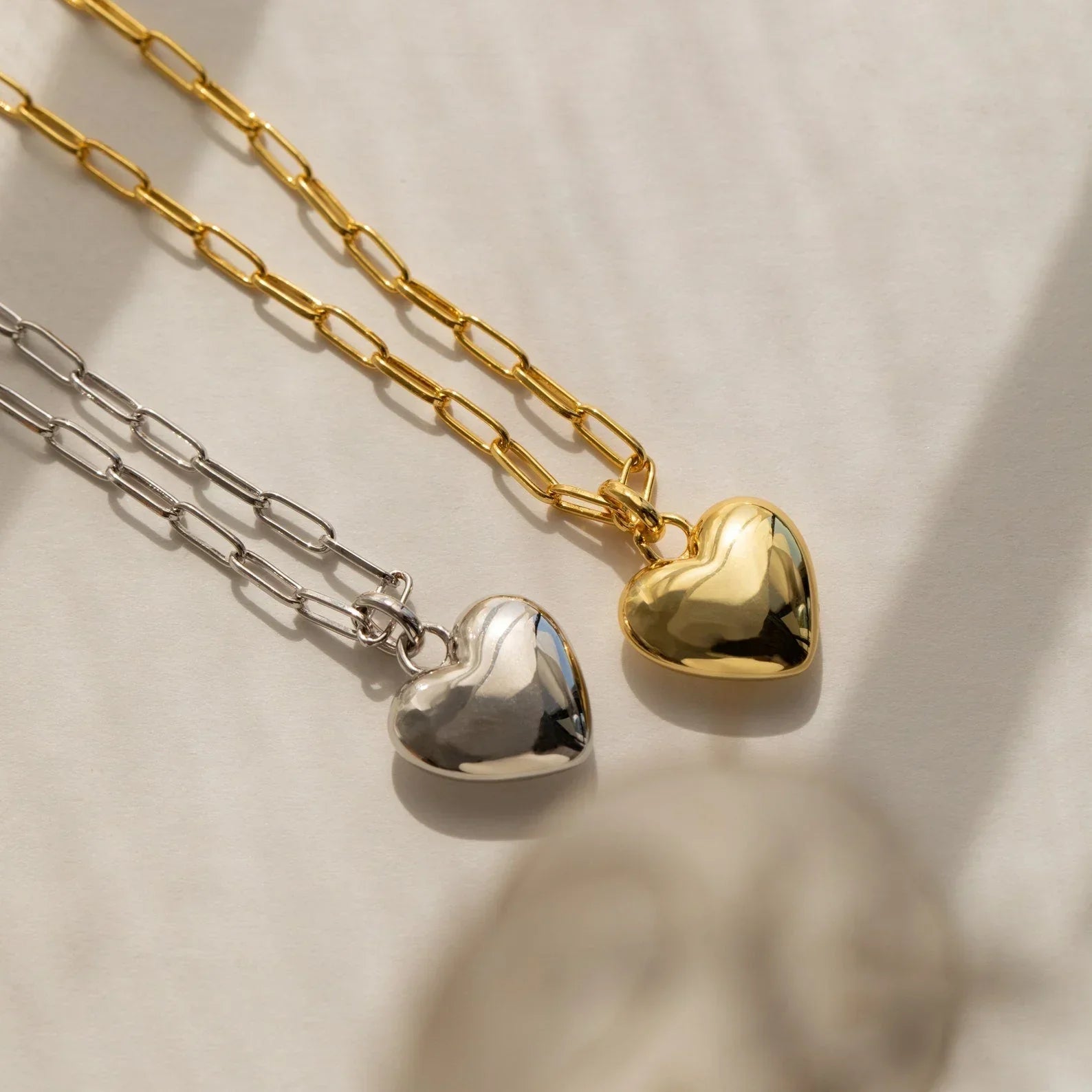 Close-up view of the Paperclip Heart Pendant, emphasizing the sleek paperclip chain and delicate heart charm.