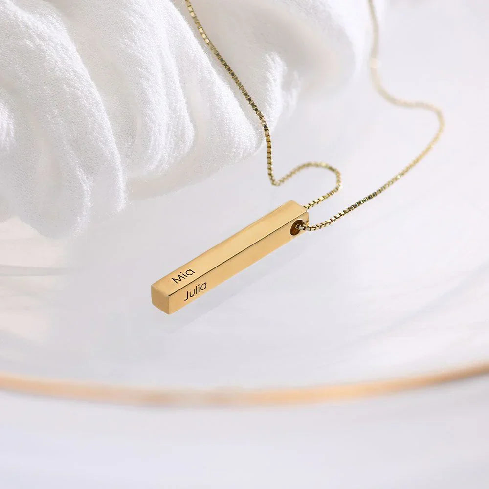 Side view of the custom necklace highlighting its minimalist design and smooth 3D engraved bar.