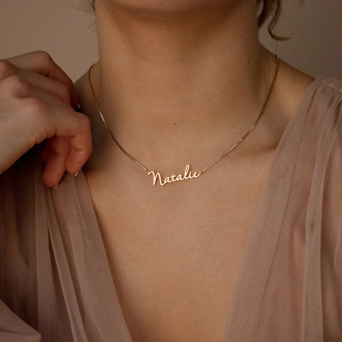 Model wearing the Personalized Callie Signature Necklace in gold, showcasing its custom engraved Callie design
