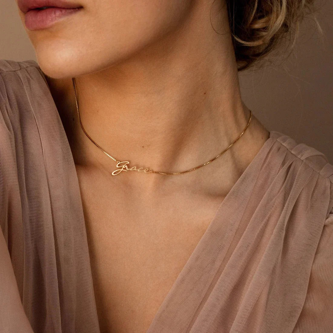 Side view of a model wearing the Personalized Callie Signature Necklace, emphasizing its sleek design and personalized engraving.