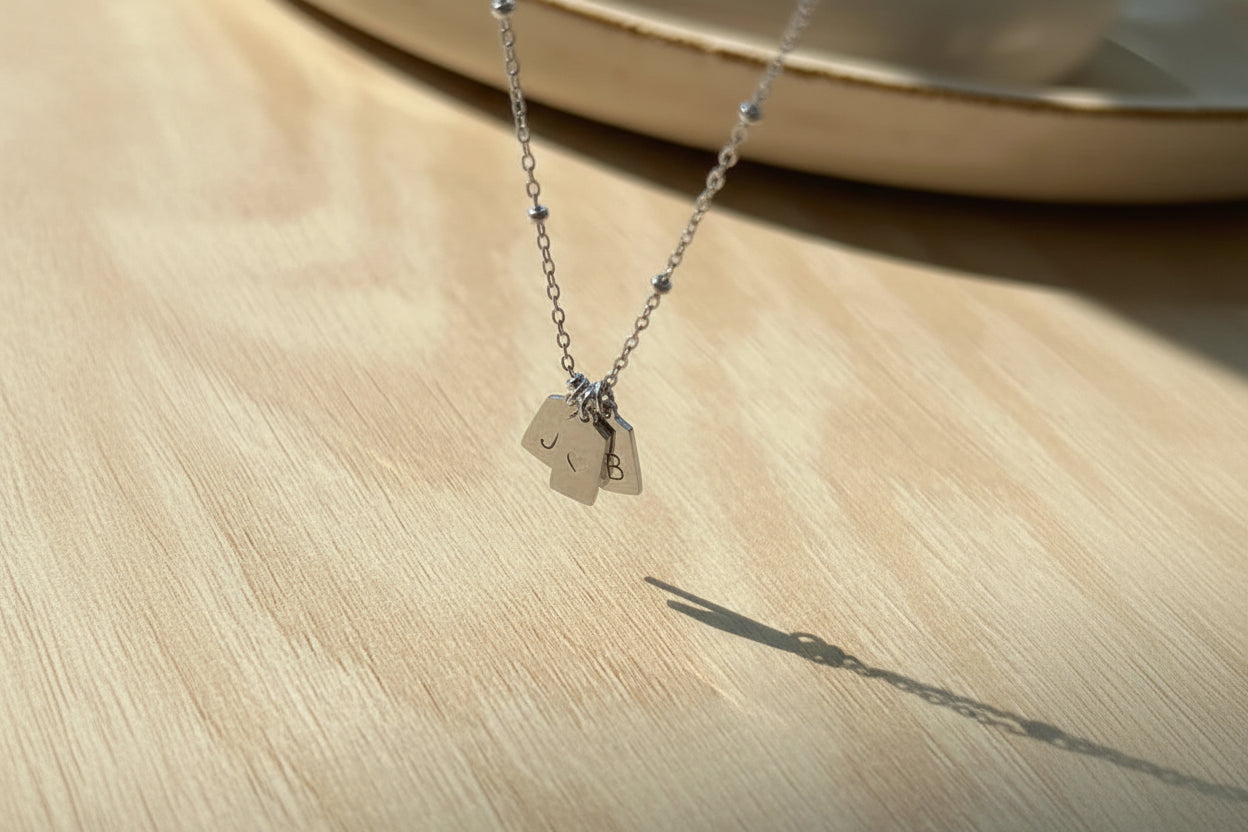 His & her initial with heart pendant