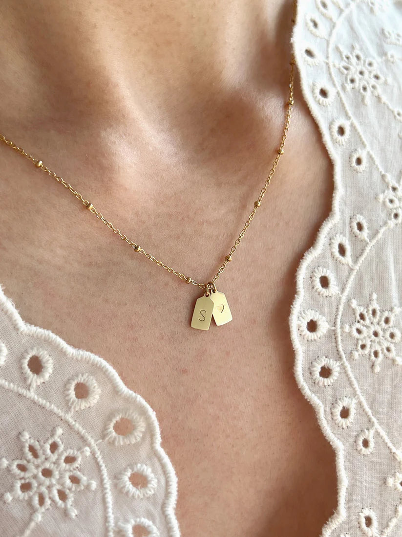 His & her initial with heart pendant