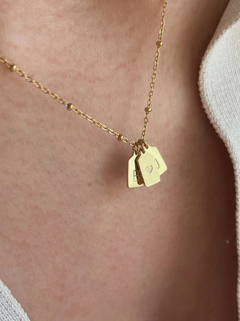 His & her initial with heart pendant