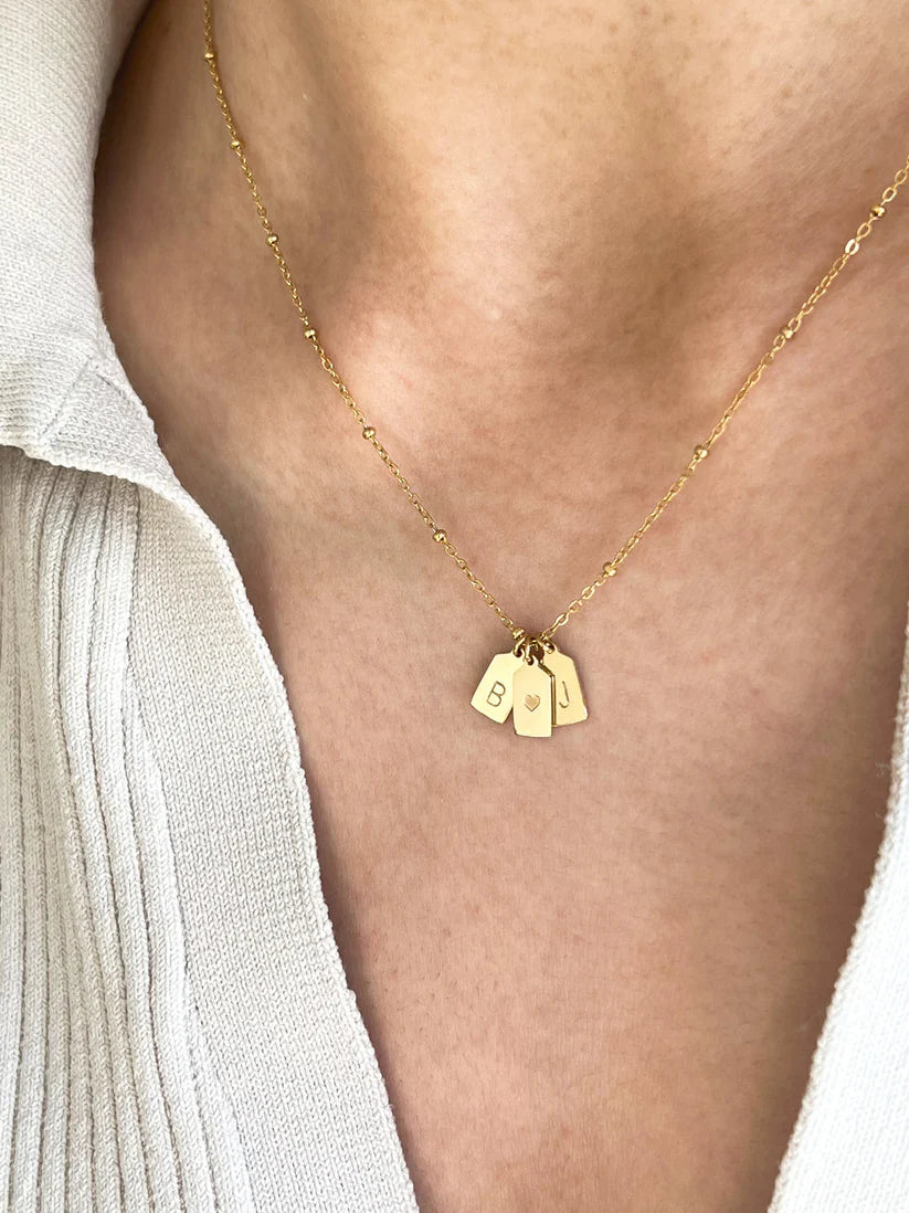 His & her initial with heart pendant