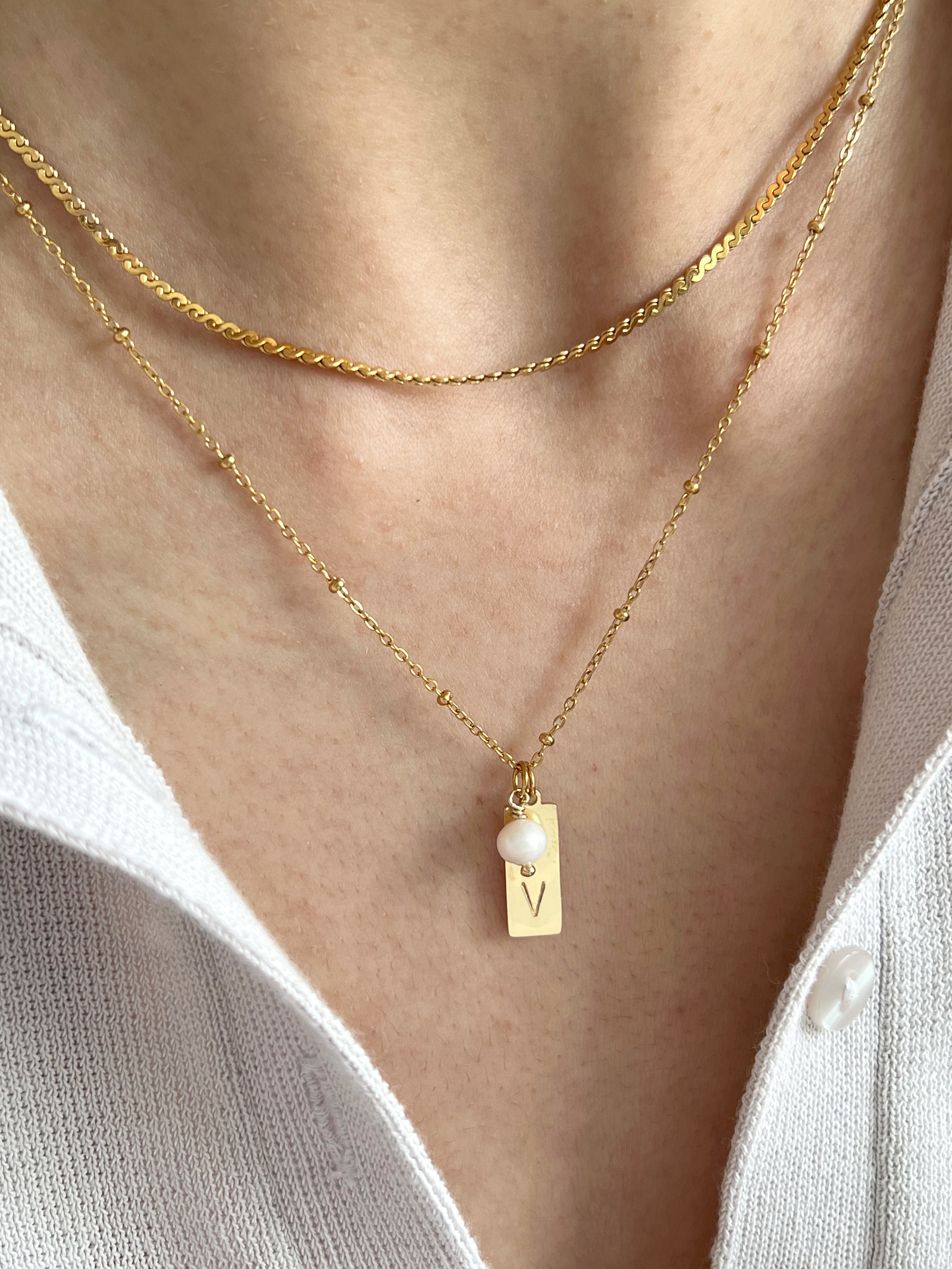 Initial pendant with pearl